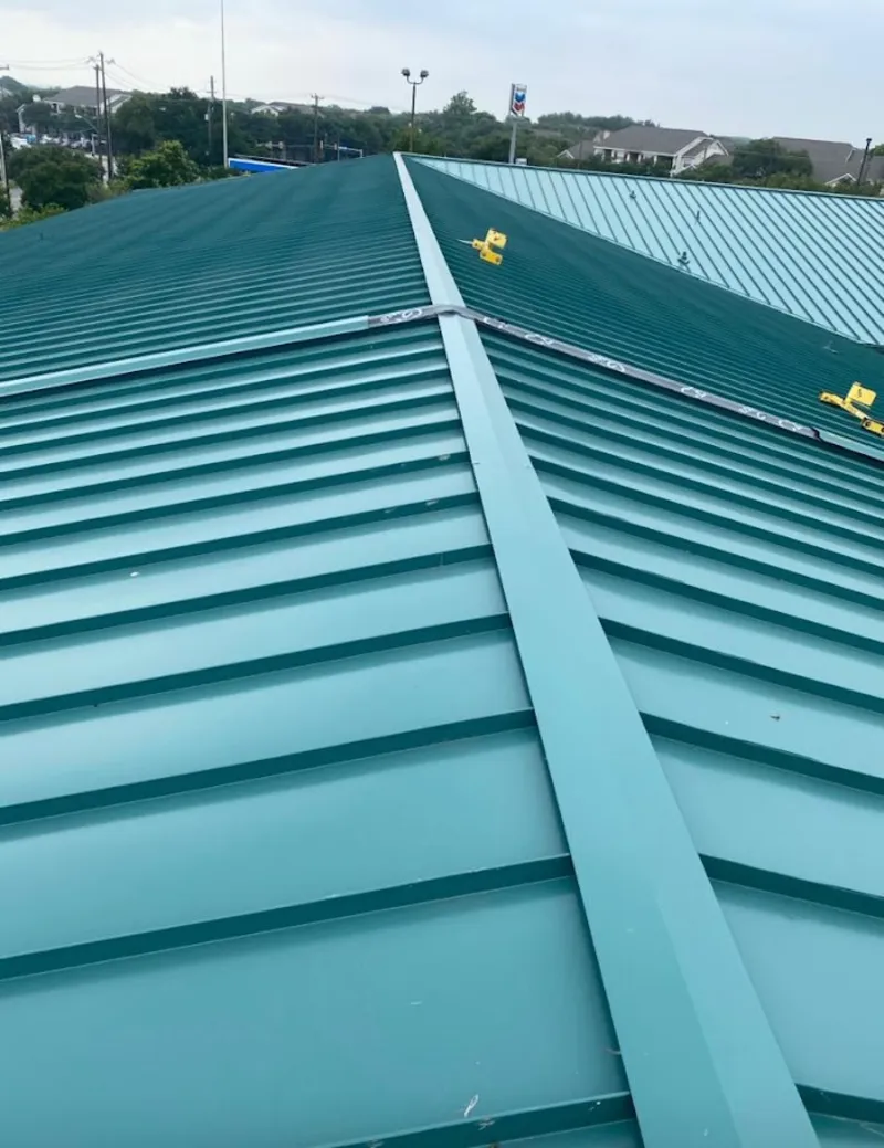 Green commercial metal roof ridge and valley for Metal Roof Repair in Windsor Heights